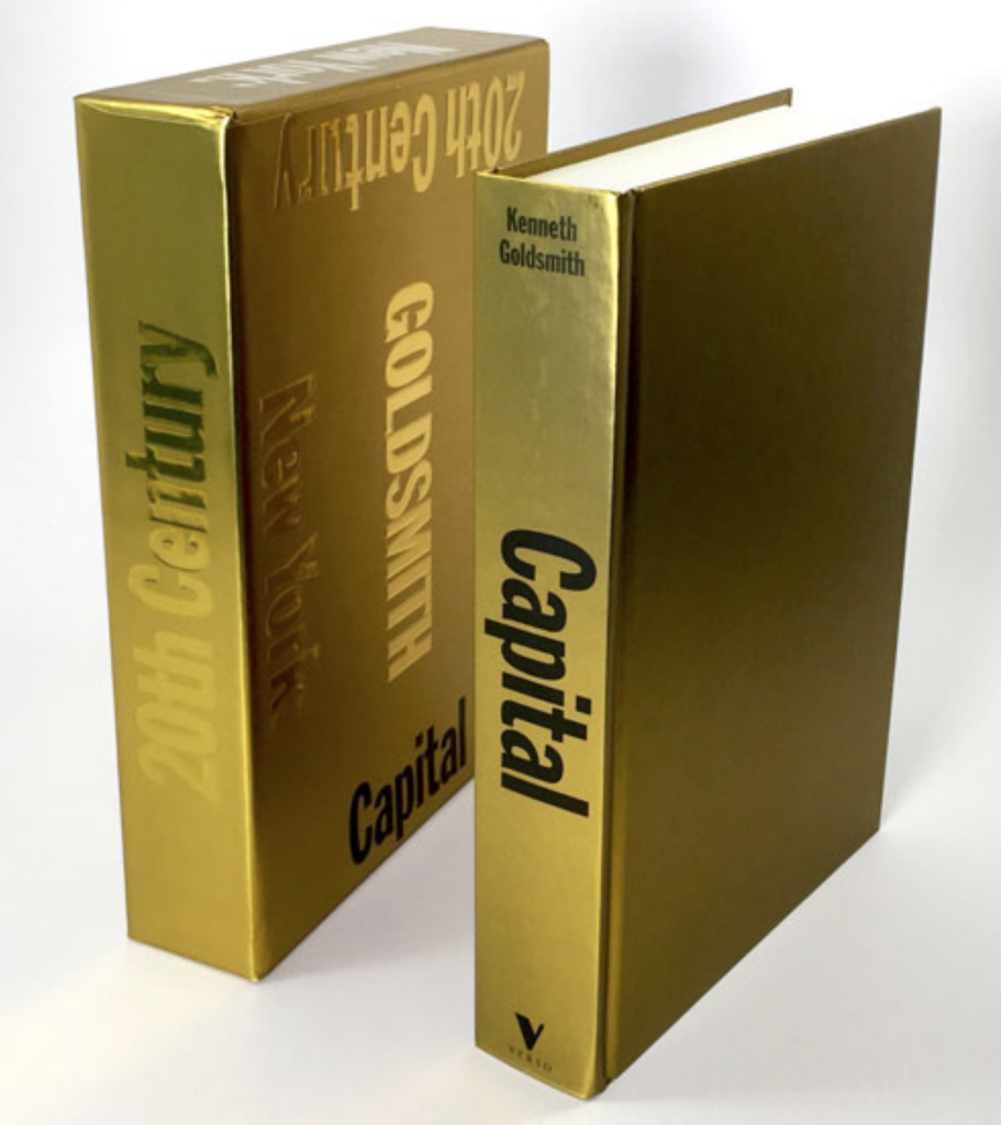 shiny gold book with the word Capital on the spine standing next to its shiny gold slipcase