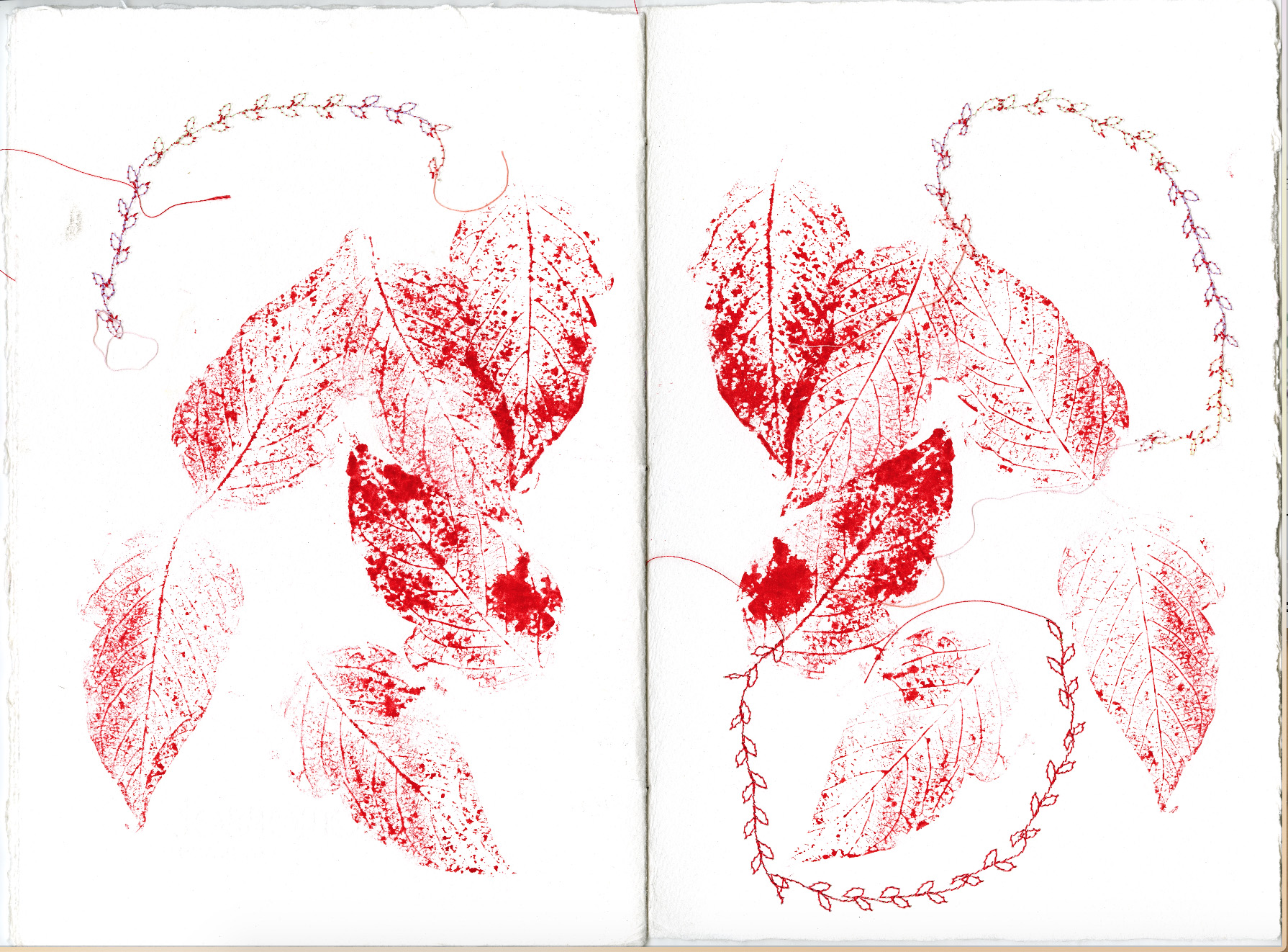 spread with red leaf prints