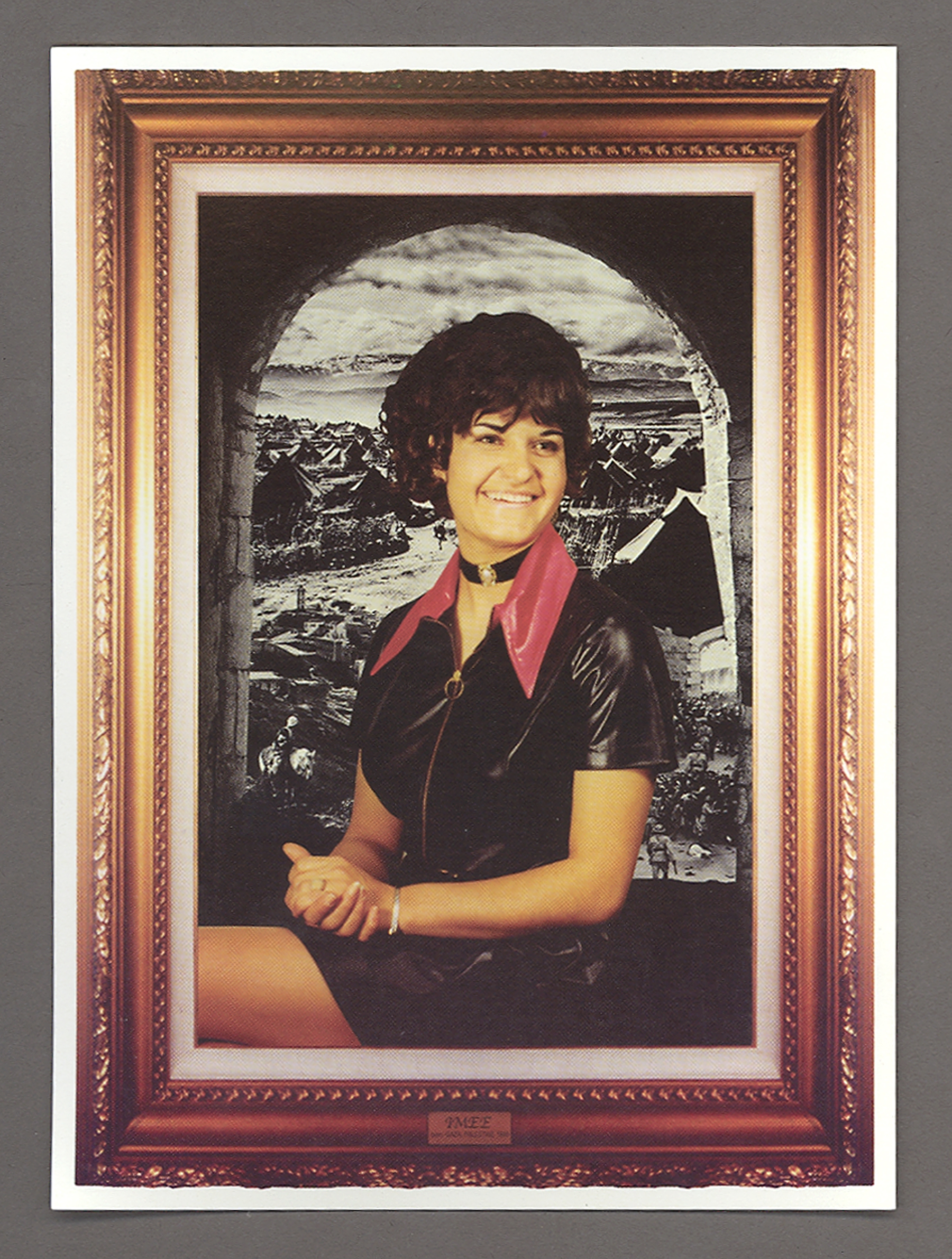 postcard with a portrait of a smiling woman with short black hair