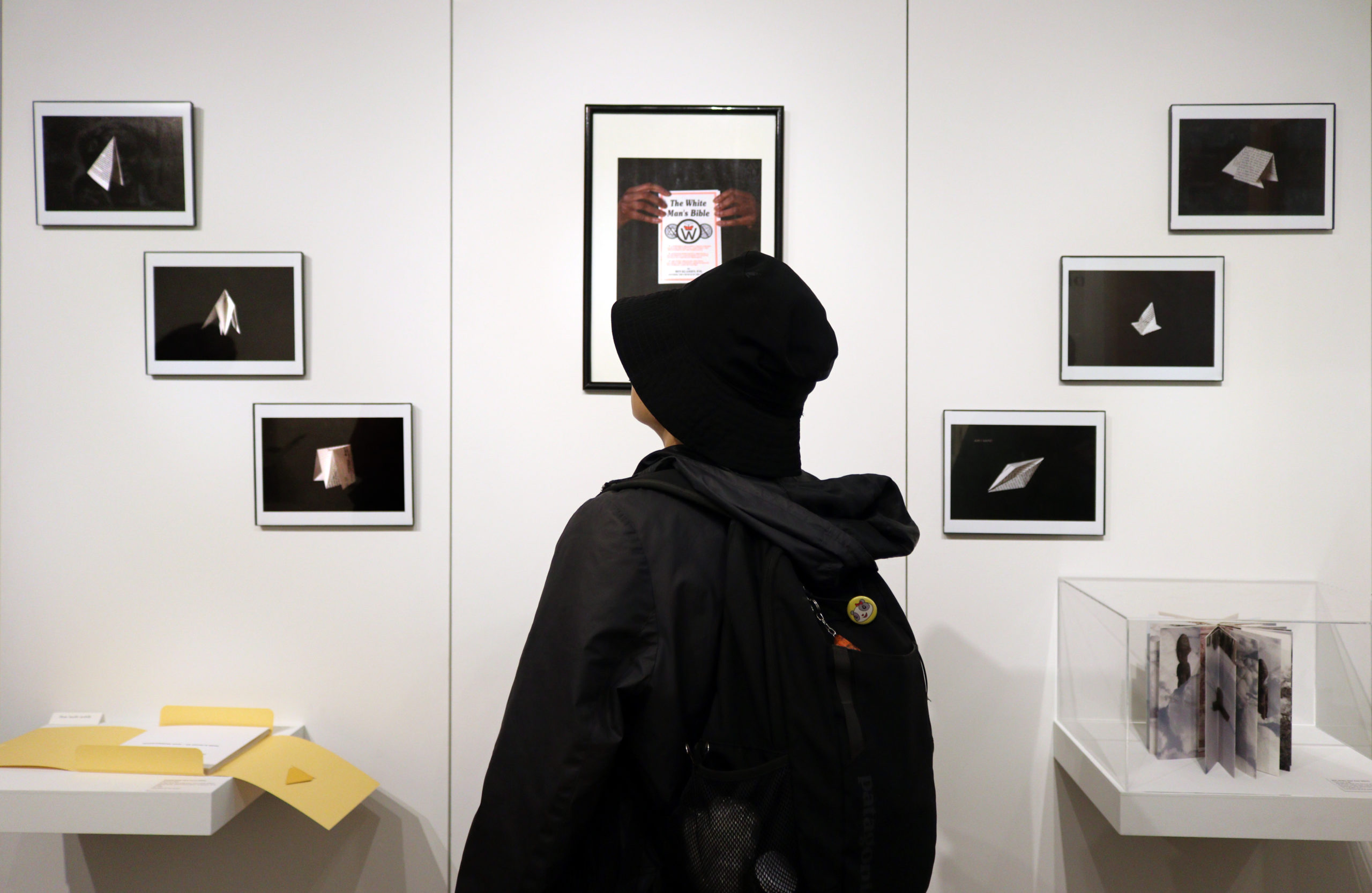 Person looking at photos in Clarissa Sligh exhibition
