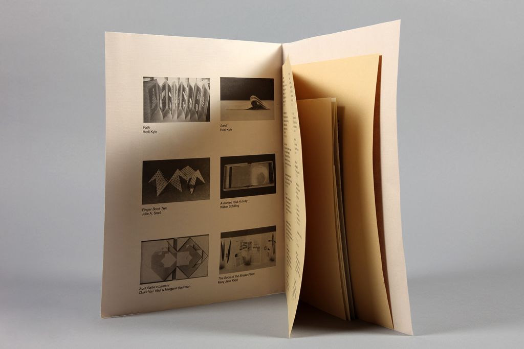 tan inside front cover with black photos of artworks