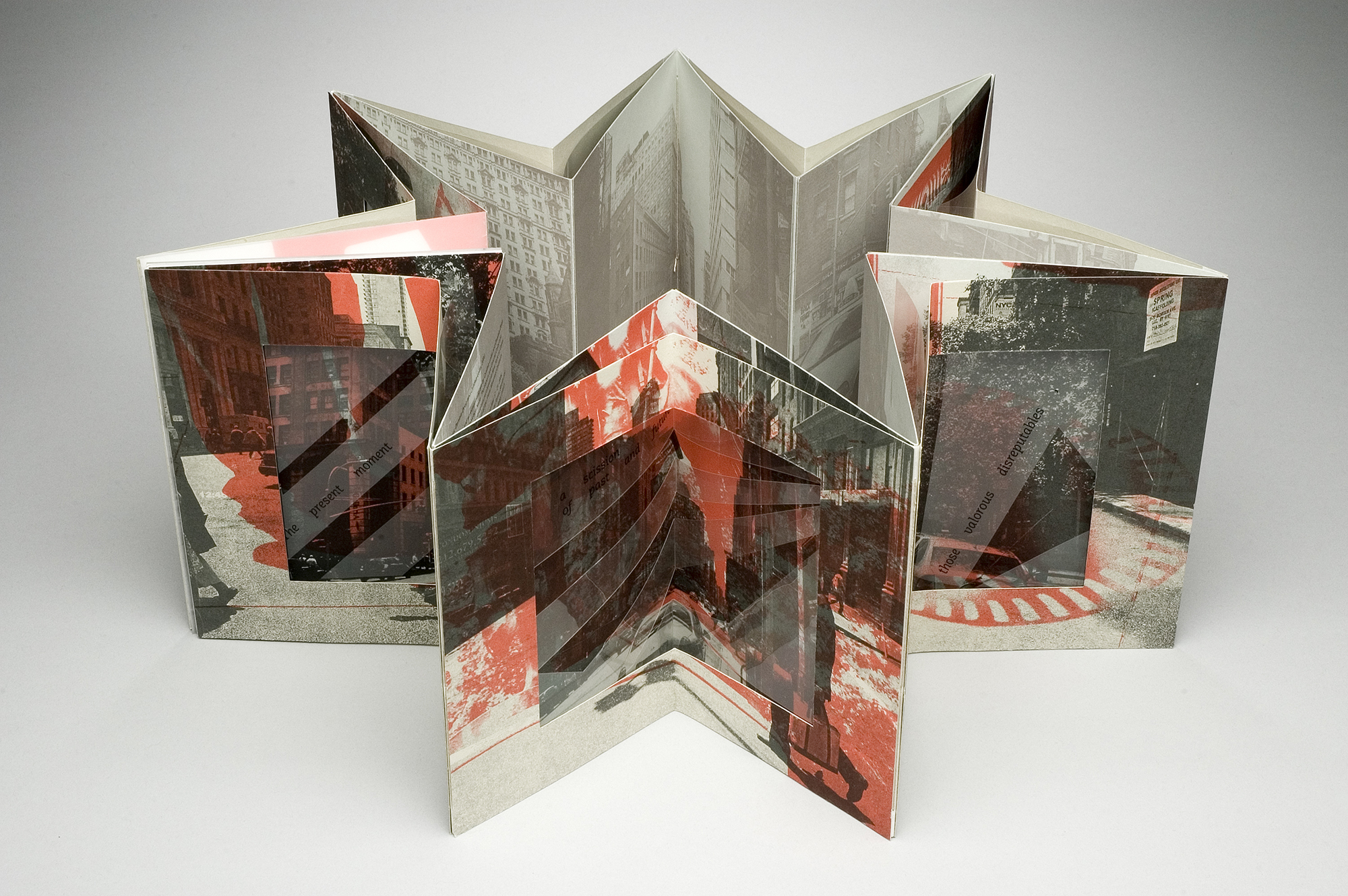 red and black accordion book displayed as a star shape