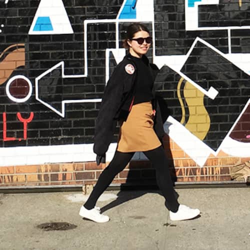 ivy zheyu chen walks down a new york street wearing sunglasses