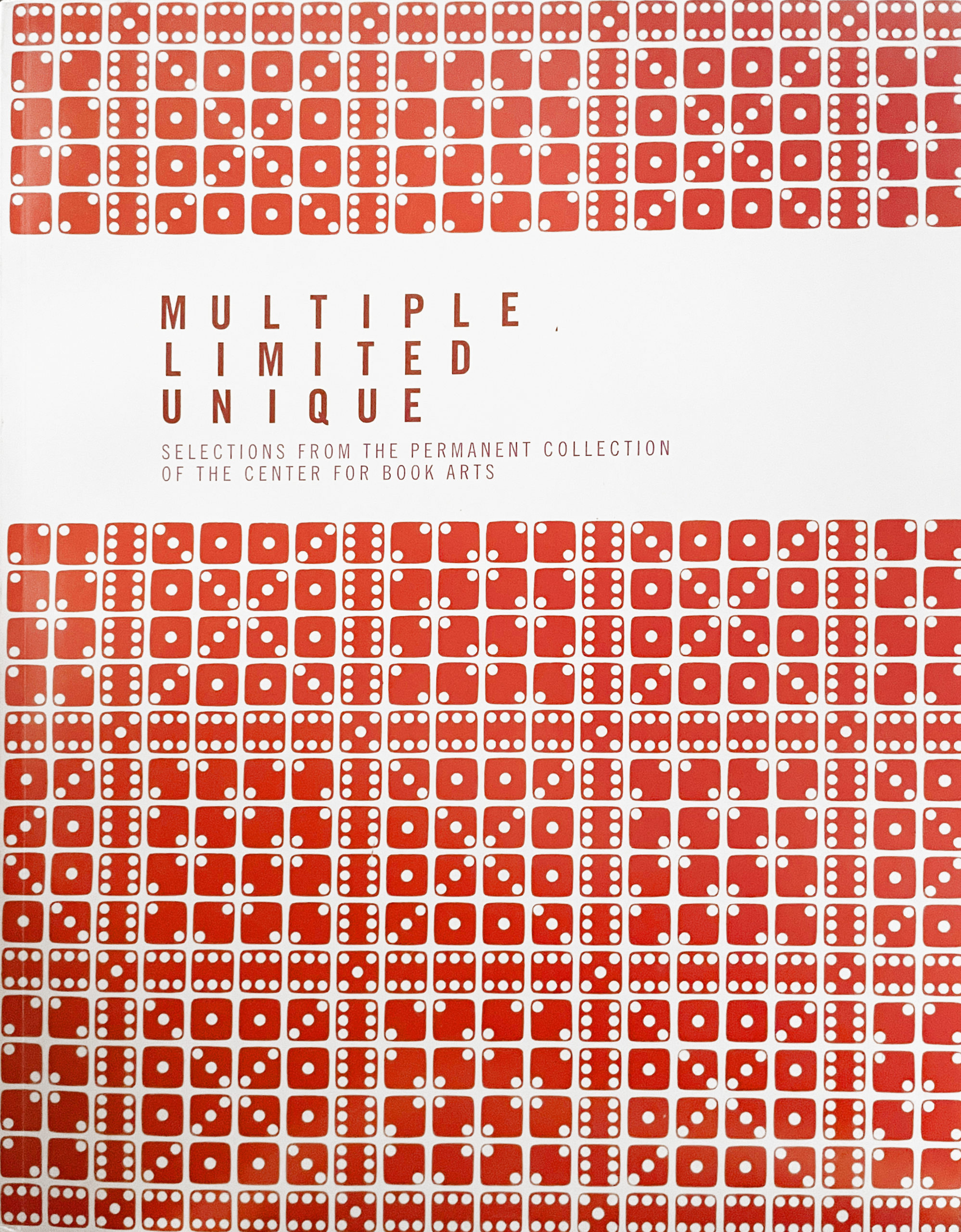book cover with a red pattern made by printing dice
