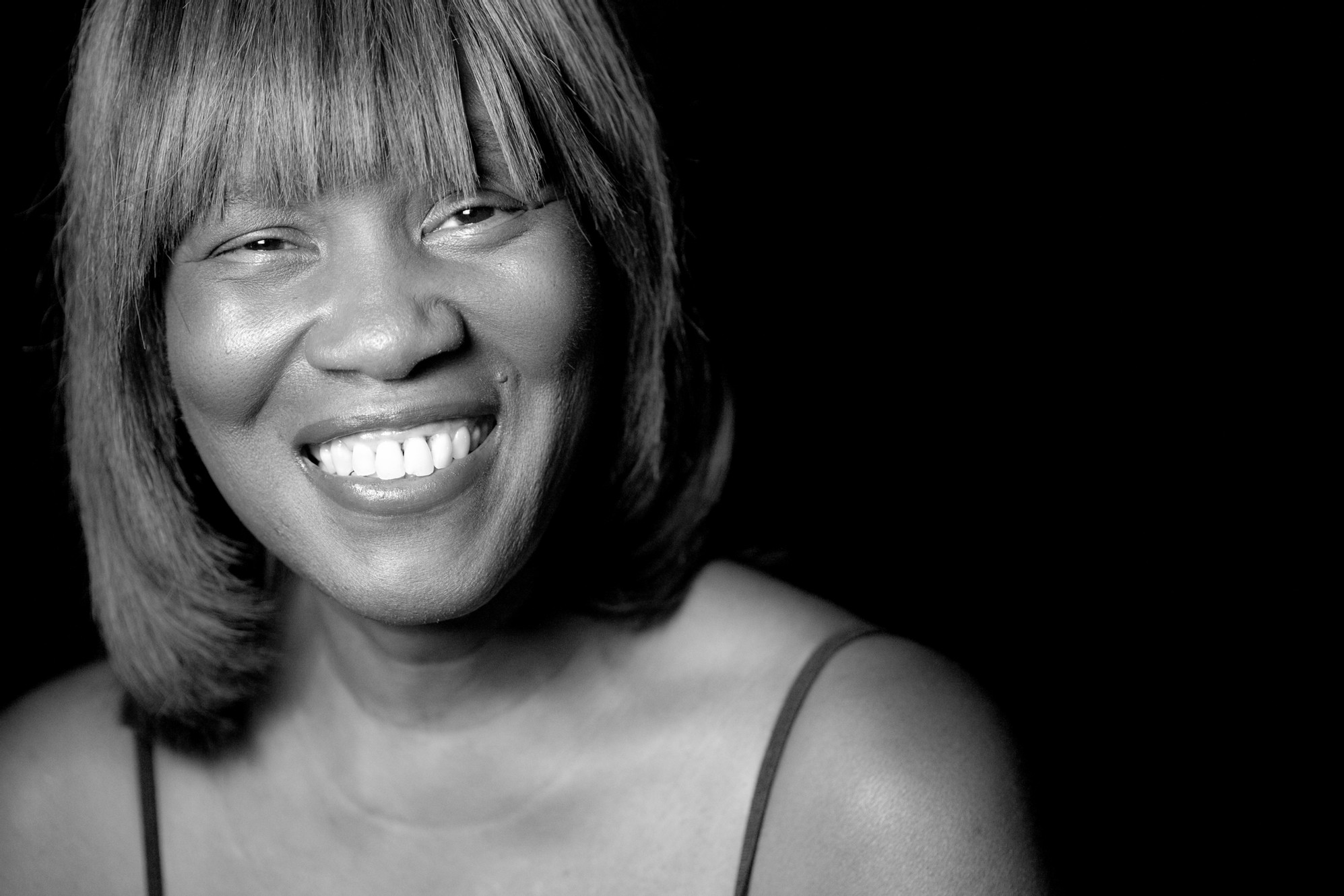 patricia smith smiles warmly at you as if you had just surprised her in the best way