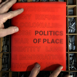 red book cover with the title "Politics of Place"