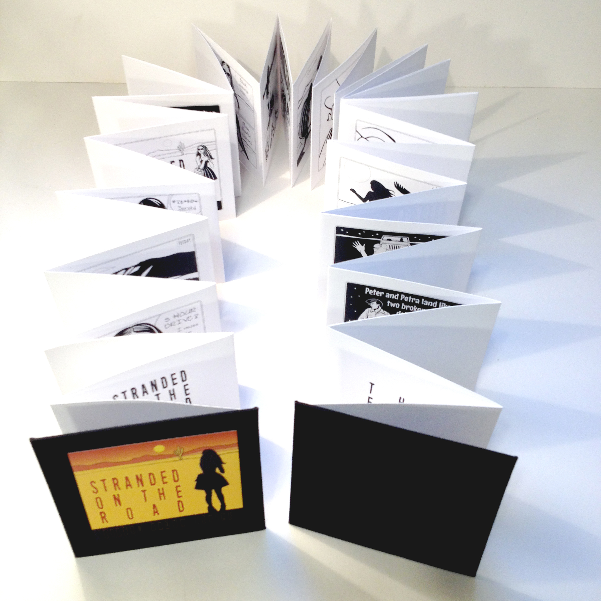 expanded accordion book with black covers