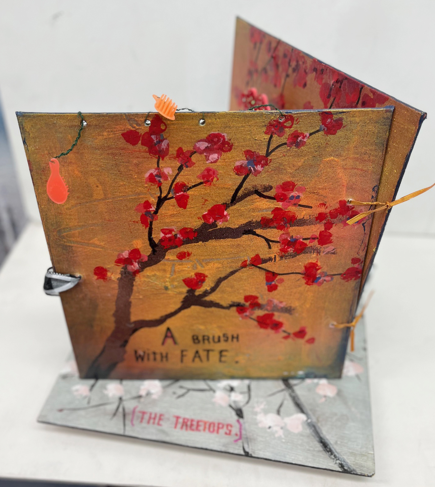 Artists' book with cherry blossom branch