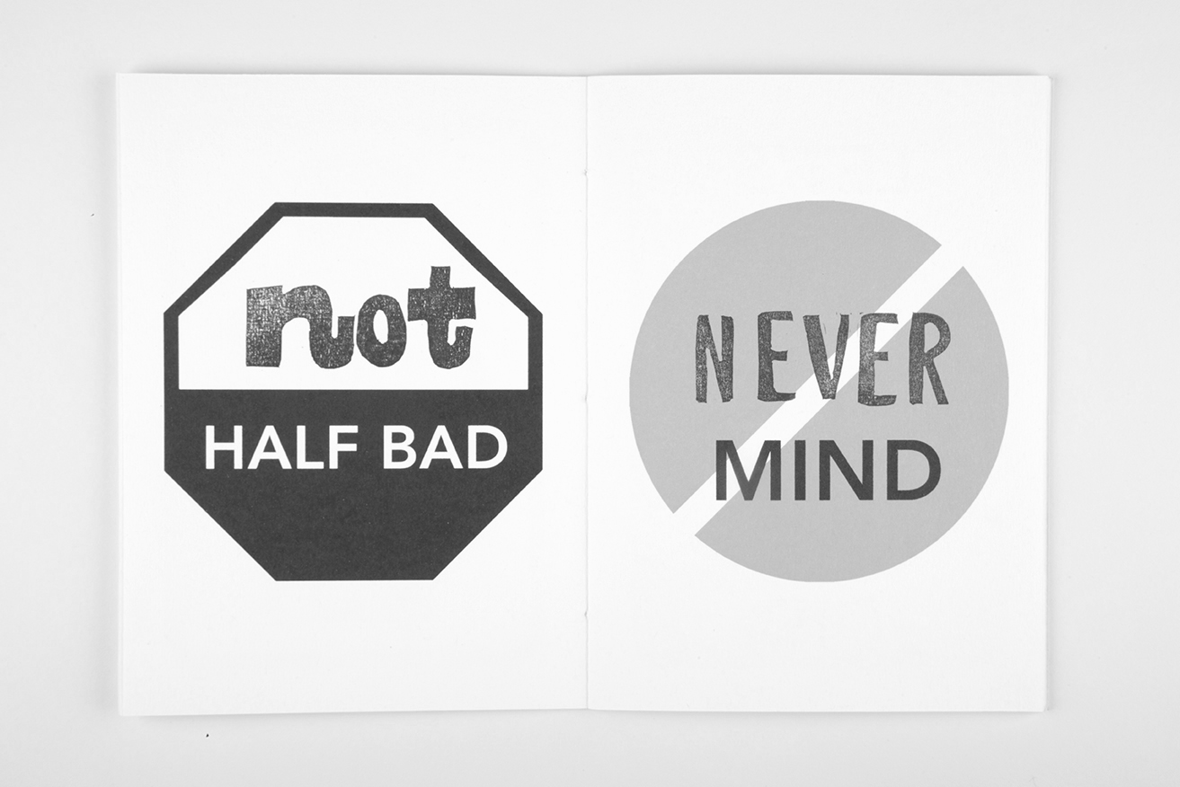 A spread that has an illustrated stop sign that reads "not HALF BAD", and on the right side, it reads "NEVER MIND"