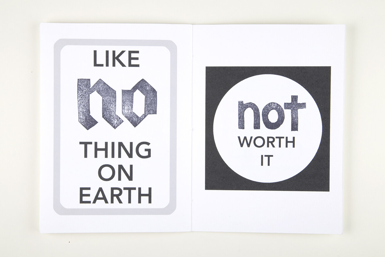 White open book over white background. Left page contains white rectangle with text that reads "Like no thing on earth". Right page contains black square with white circle inside. On top of the circle, a text reads "Not worth it".