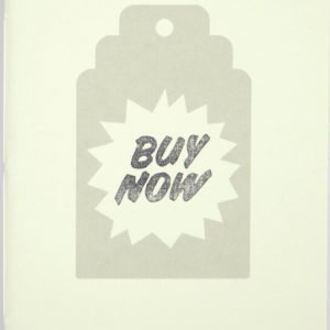 White artists' book over white surface, the cover shows a stamped-like grey price-tag which contains the words "Buy Now"