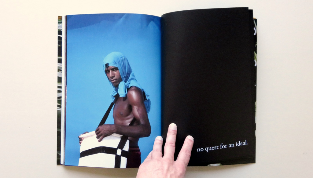 book spread open to image of dark skinned shirtless man
