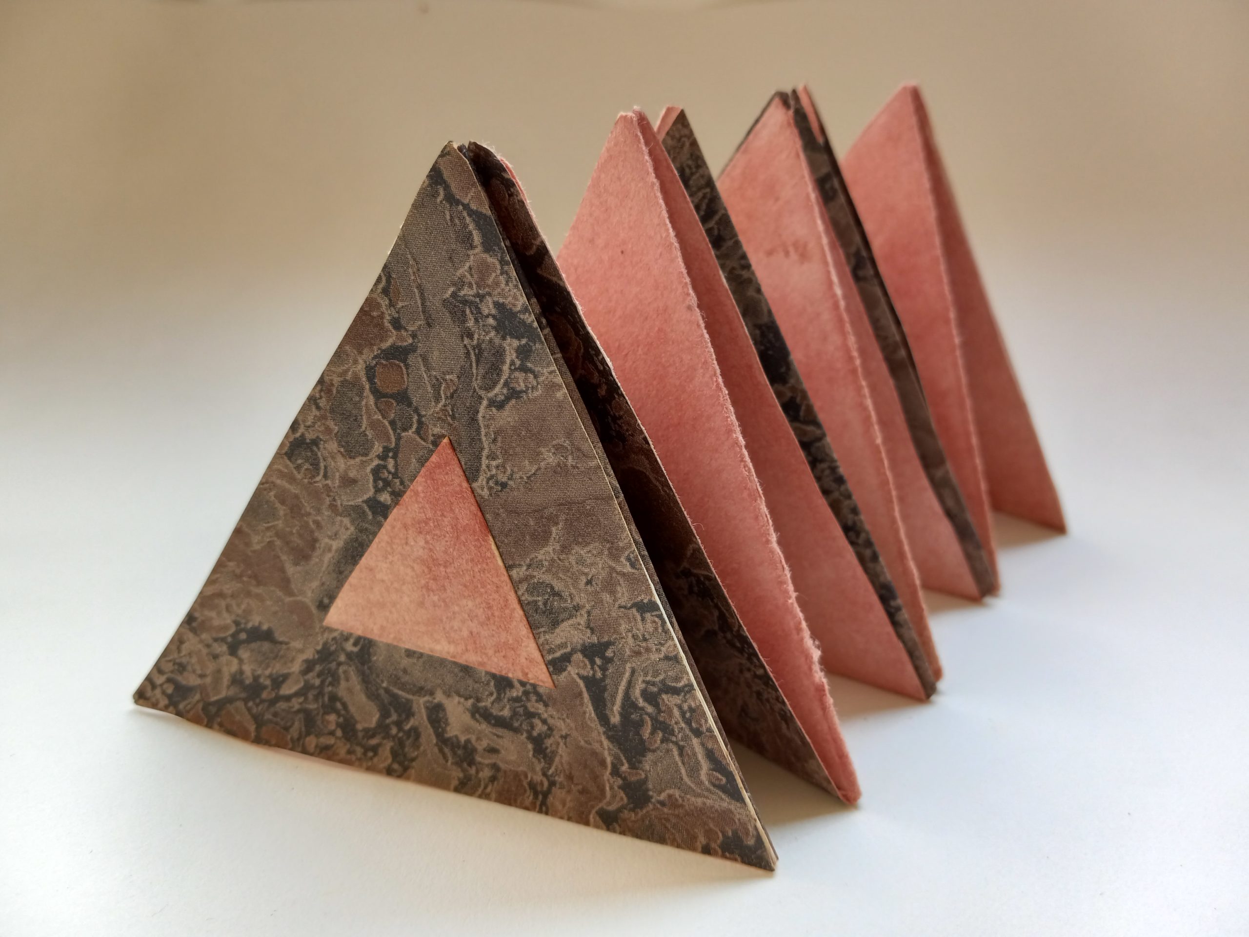Accordion book in the shape of a triangle