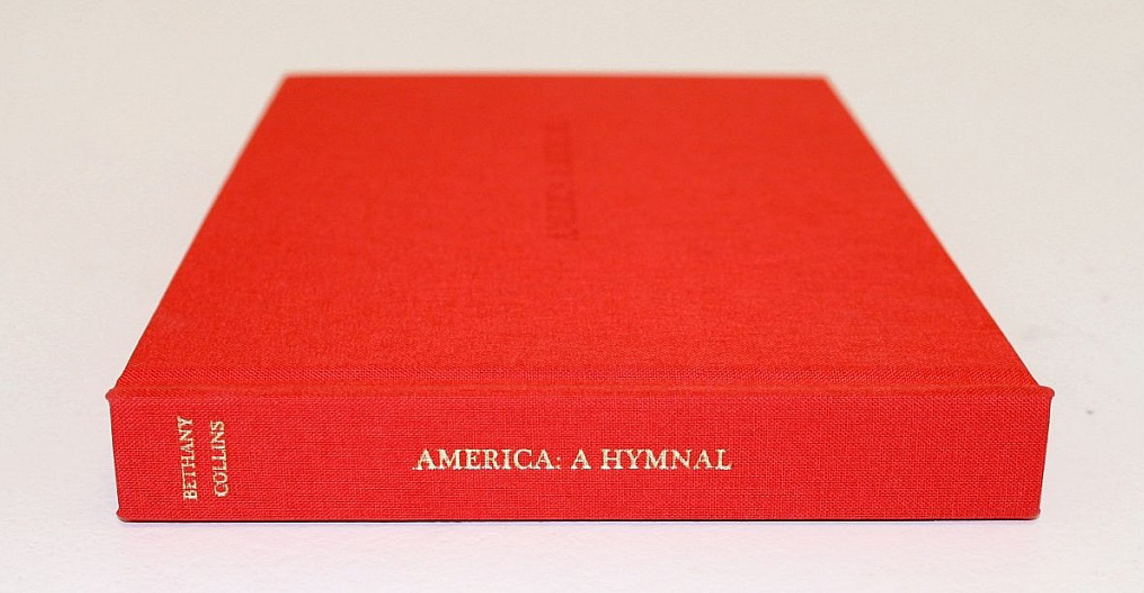 red cloth covered book with gold title on spine