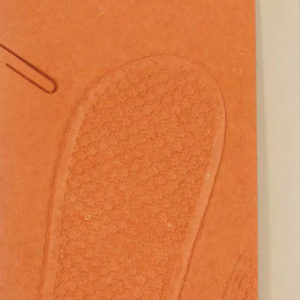 book cover with imprint of shoe tread