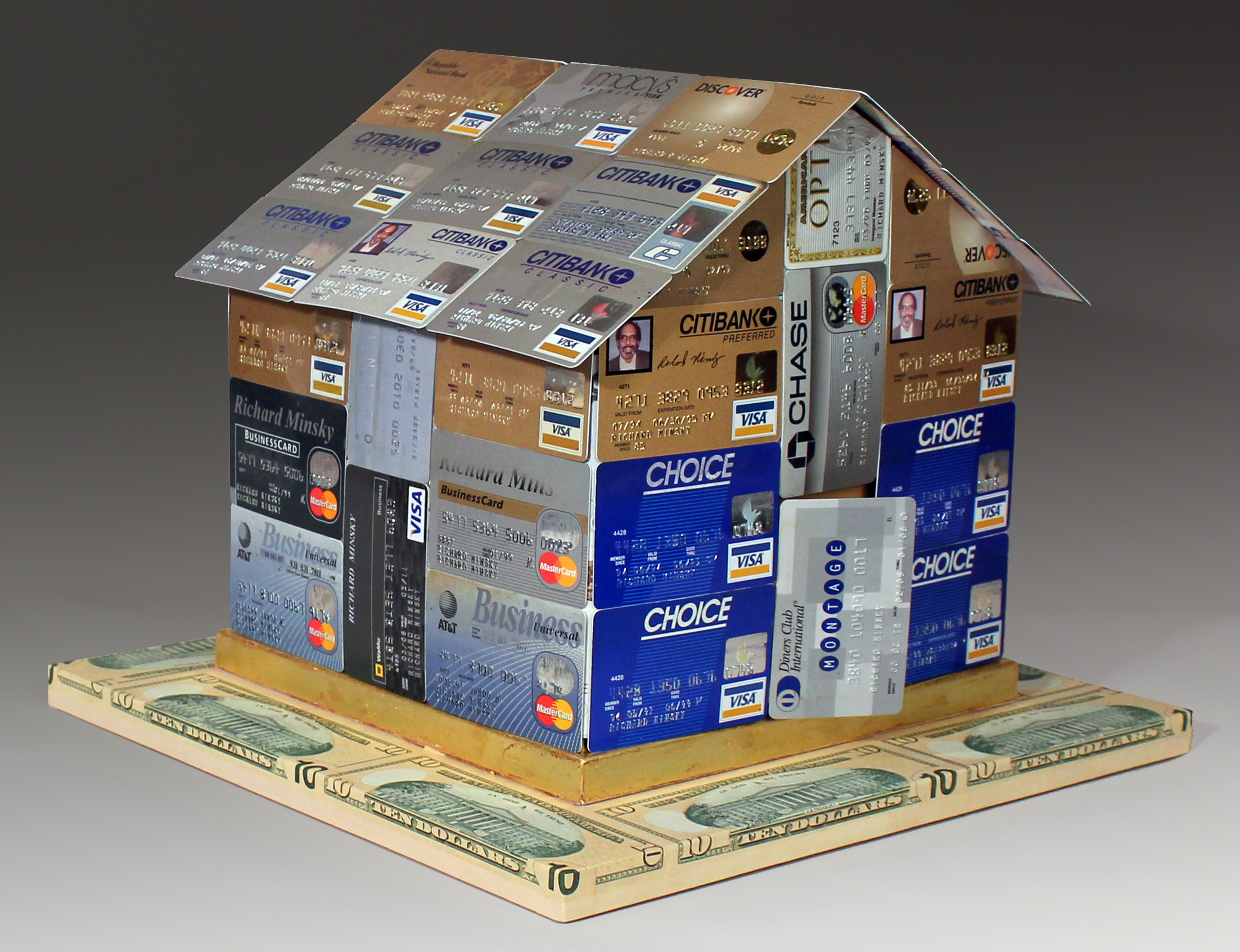 three dimensional house made of credit cards