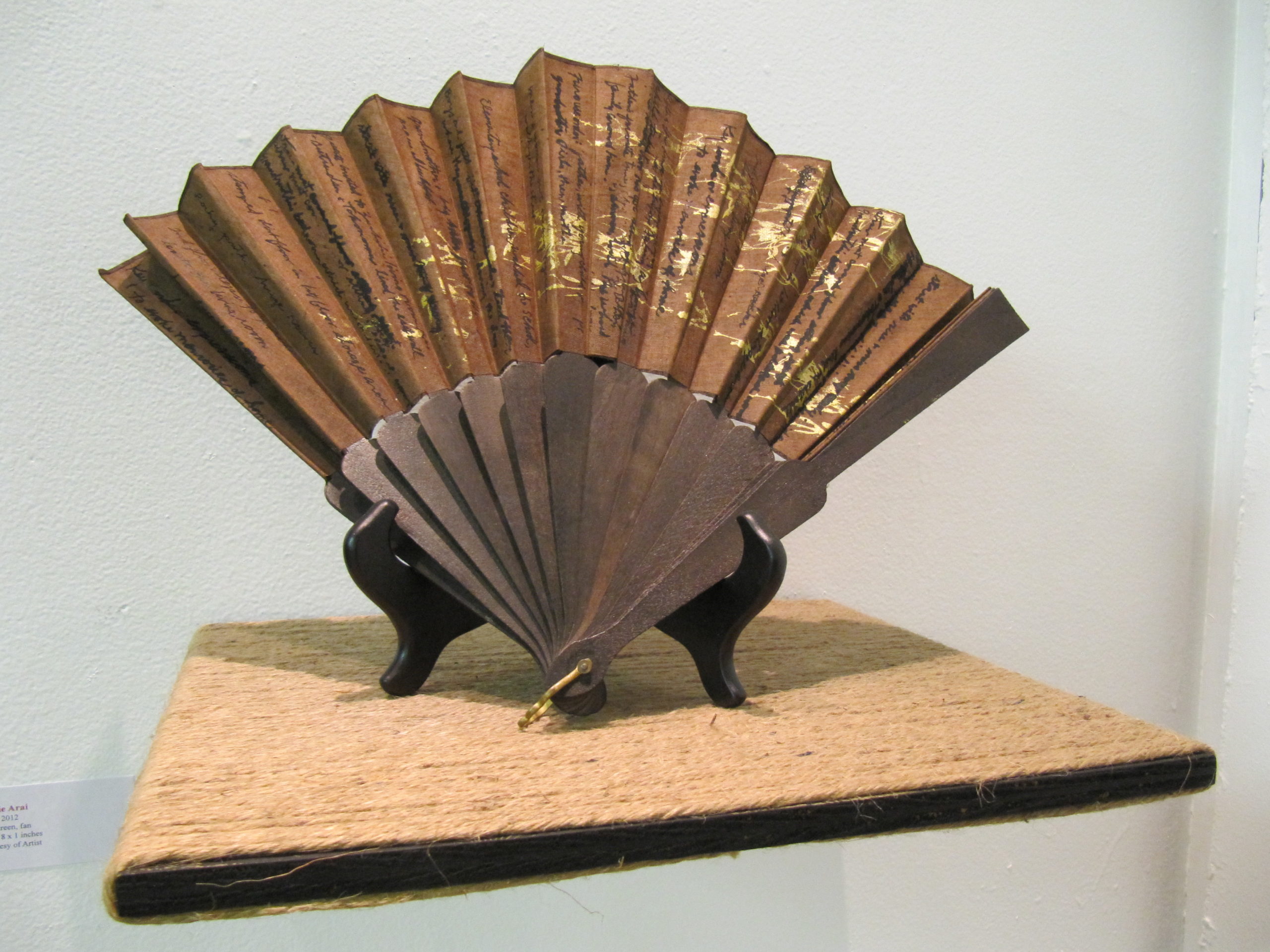 Gold and brown folding fan