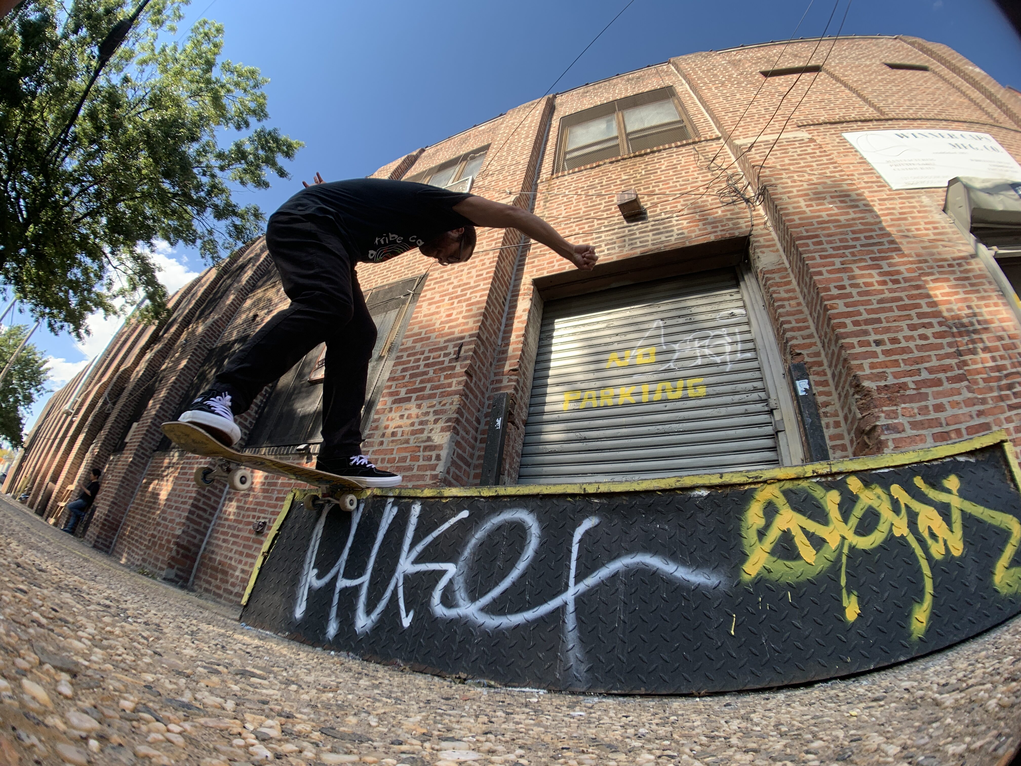 Person skateboarding does a nose grind on a 2 foot ledge