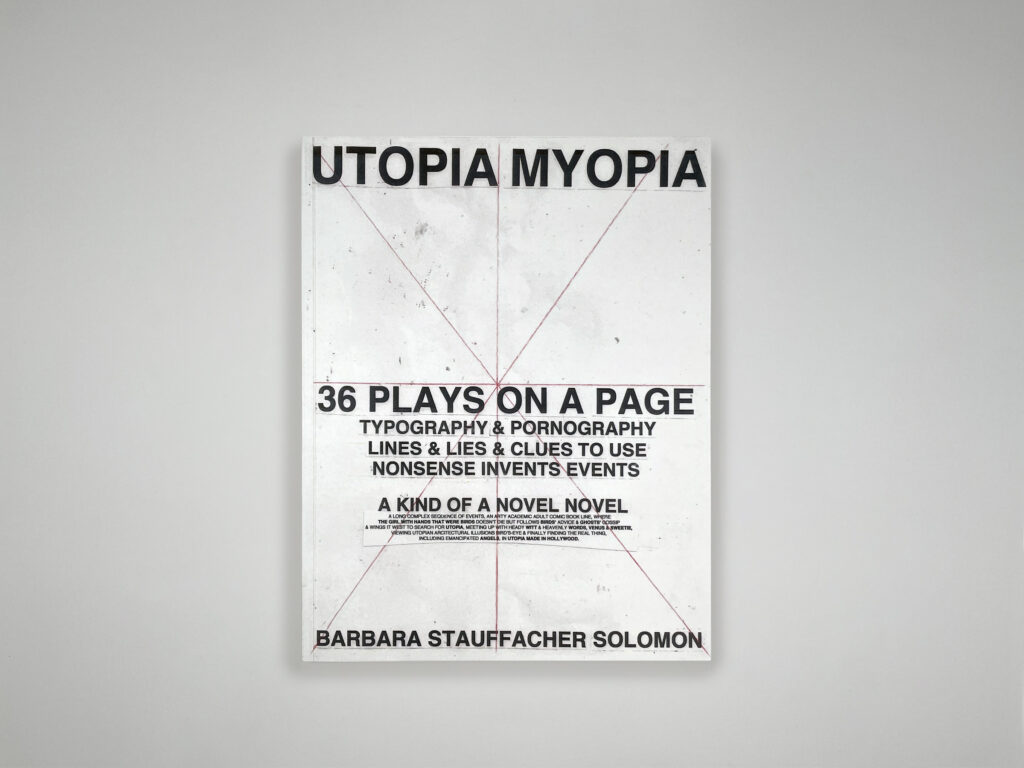 white softcover book with the title printed in block letters and 8 red lines intersecting in the middle