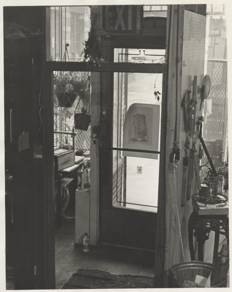View of door from the inside of Center for Book Arts looking out at bleecker street